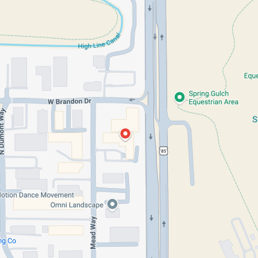 Map showing a marked location near Mead Way and US 85, adjacent to the Spring Gulch Equestrian Area and surrounding businesses.